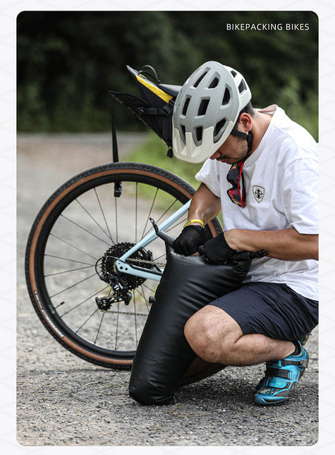 Waterproof 14L harness saddle bag on a touring bicycle