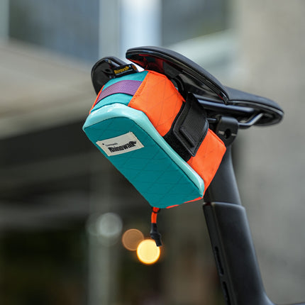 Rhinowalk Cosmopolis 0.6L bike saddle bag mounted beneath a bicycle seat