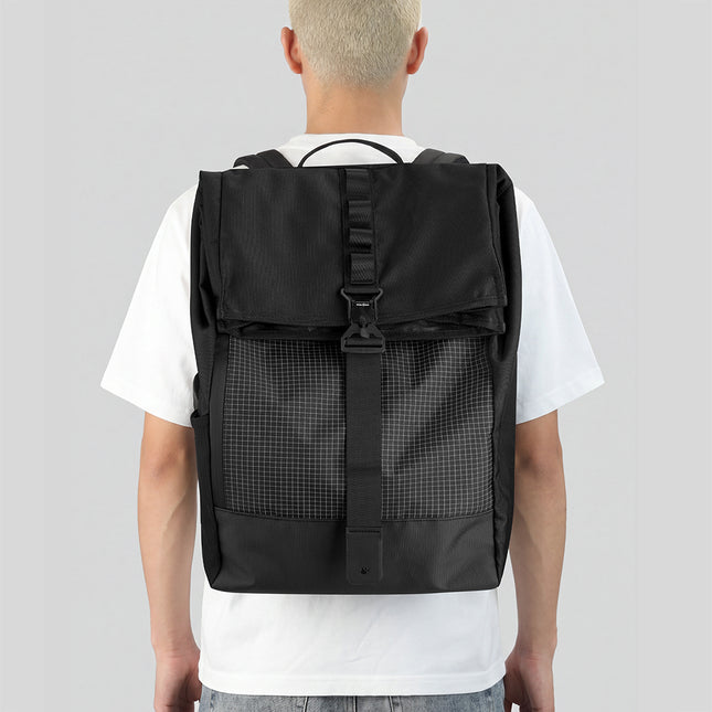 Back view of a rider wearing the Rhinowalk MBB3001 backpack