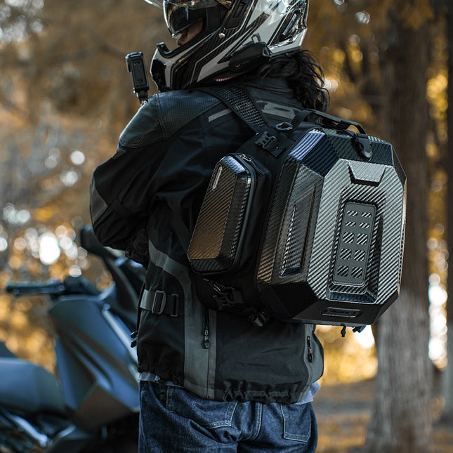 Rider carrying the new Carbon Black MFT2310 as a backpack