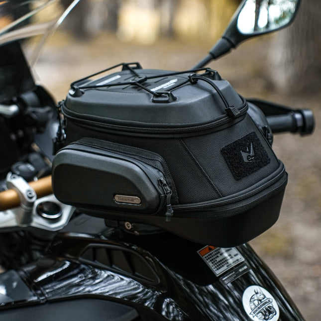 MJX2014 black tank bag installed on a motorcycle outdoors